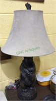 Hard plastic standing bear table lamp with a tree