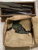 Box filled with hand files, saw blades, box of