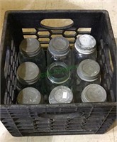 Milk crate with nine ball jars with 8 zinc lids,