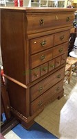 Five drawer oak finish tall chest of drawers, all