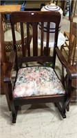 Antique oak rocking chair with a floral padded