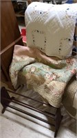 Two quilts and a shoe rack, white quilt with