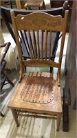 Antique oak wood press back chair with a added