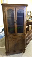 Thomasville Oak corner cabinet with two glass