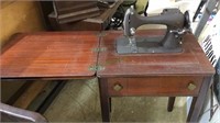 Vintage Montgomery Ward sewing machine on table