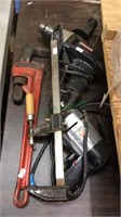 Four different tools, large 18 inch pipe wrench,