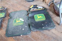 Two sets of floor mats for a truck