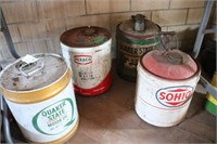 Group of four oil cans