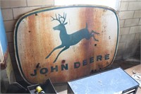 Vintage four legging John Deere sign with wear