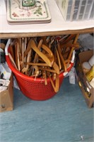 large basket of wooden coat hangers