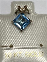 $100. 10KT Gold Blue Topaz Pendant
