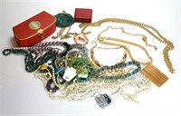 Large lot of costume necklaces and a card case