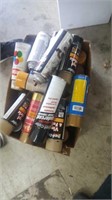 Box of spray paint and other