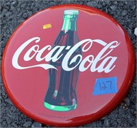 2 round metal Coca-Cola signs