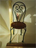 Neat little doll wrought iron with wicker doll