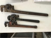 Three (3) pipe wrenches