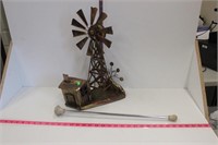 Baton and tin musical windmill