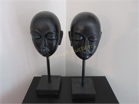 Two ebony face figures