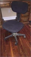 Small black padded office chair