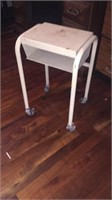 White rolling metal side table