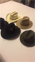 Five miscellaneous hats including cowboy