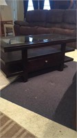 Coffee table with glass top and drawer