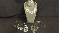 THREE SILVER TONE NECKLACE AND EARRING SETS (TWO