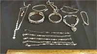 SELECTION OF (12) SILVER-TONE BRACELETS AND