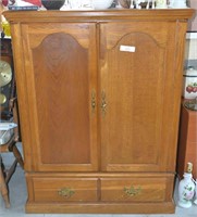Wooden entertainment center w/ two doors & large