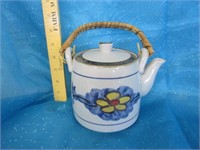 Rancing of Japan ceramic teapot with wicker
