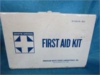 White Cross First Aid Kit with supplies; metal