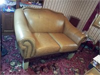 Leather loveseat with wood trim