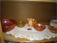 Contents shelf for curio cabinet carnival glass
