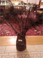 Pottery vase with peacock feathers