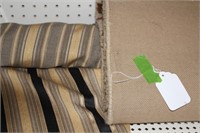 Roll of Fabric and Area Rug