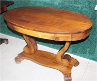 Empire mahogany oval library table with one