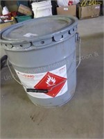 Partial pail of adhesive