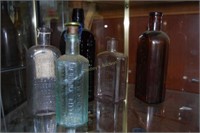 Grouping of 5 tonic bottles incl. M Burke, J Hoss