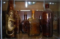 Grouping of 6 amber liquor & wine bottles