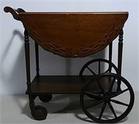 Wooden serving cart on wheels