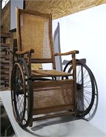 Wooden wheelchair with cane seat