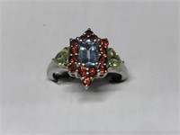 $150 St. Sil.  ring with garnet blue topaz and per