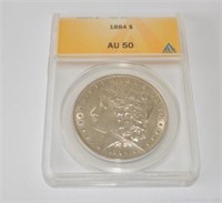 1884 Morgan silver dollar, au50 graded by ANACS