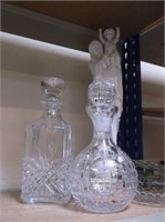2 CRYSTAL DECANTERS WITH STATUE