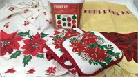 2 Poinsettia aprons and pot holders and 7 piece