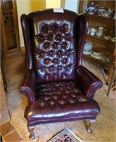 Maroon button-tuck wingback gentlemens chair