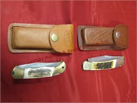 2 pocket knives w/ leather sheaths: 1 is no name &