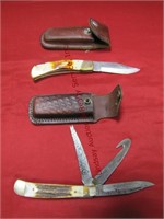 2 pocket knives w/ leather sheaths: 1 is a 3-in-1