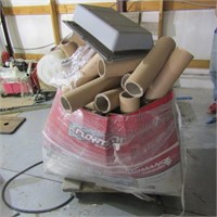 Cardboard tubes on rolling cart