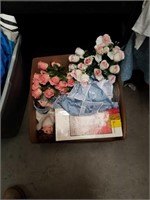 Box of flowers and dolls